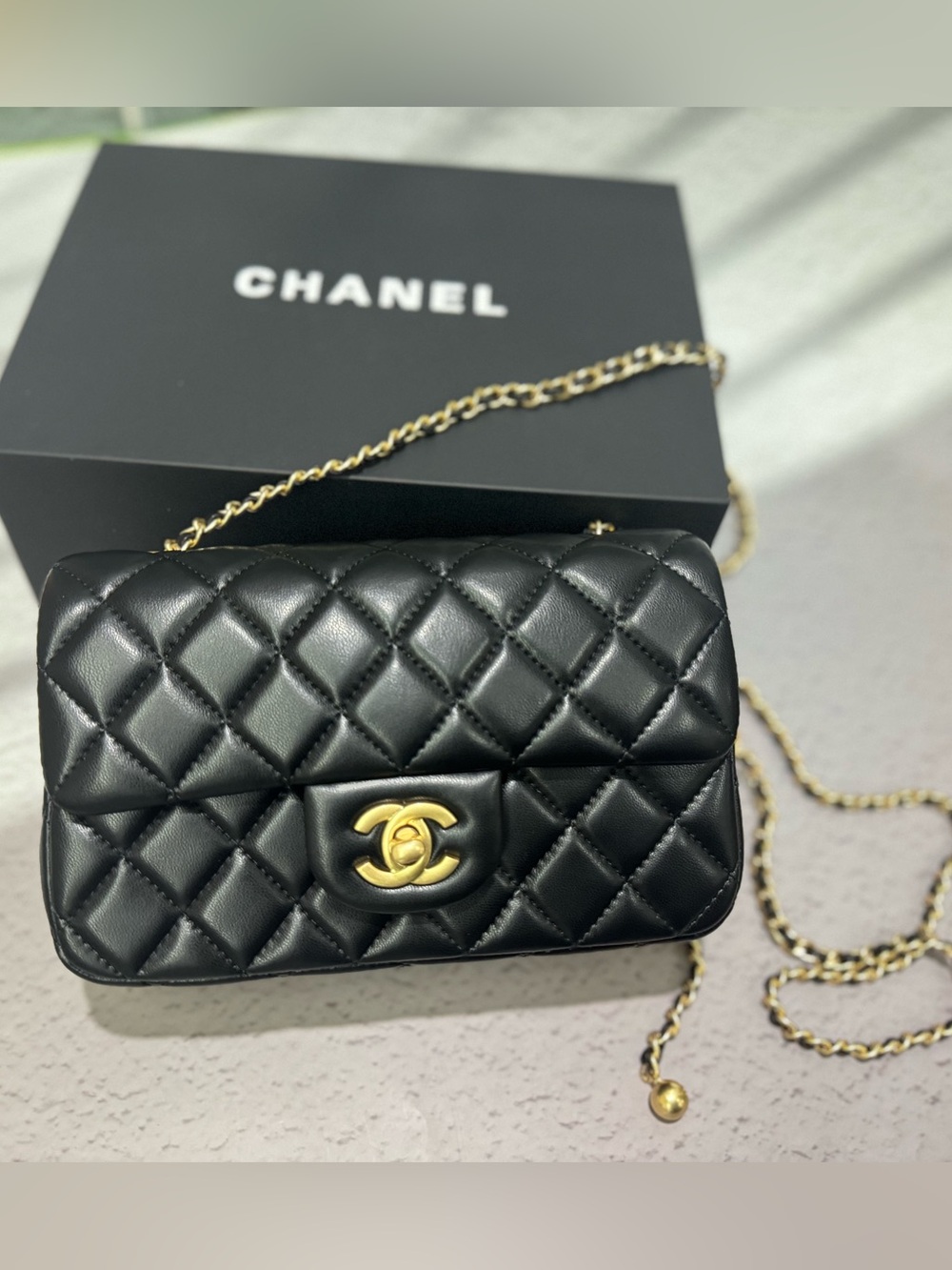 CHANEL Black Quilted Lambskin Mini Flap Crossbody with Gold Chain